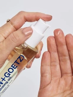 Malin+Goetz Facial Cleansing Oil -Yogamatters fc 122 04 facial cleansing oil on person 1 hi